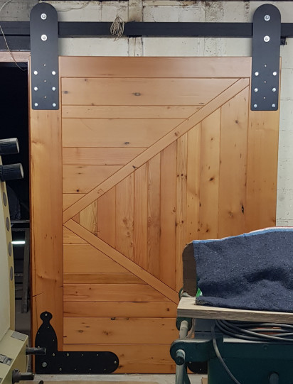 Thick Oregon Pine Barn door with oversized sliding gear in black steel