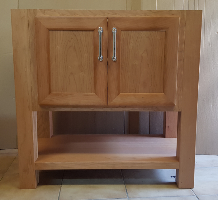 Solid Cherry Vanity with Chrome handles. Two doors on soft close hinges.